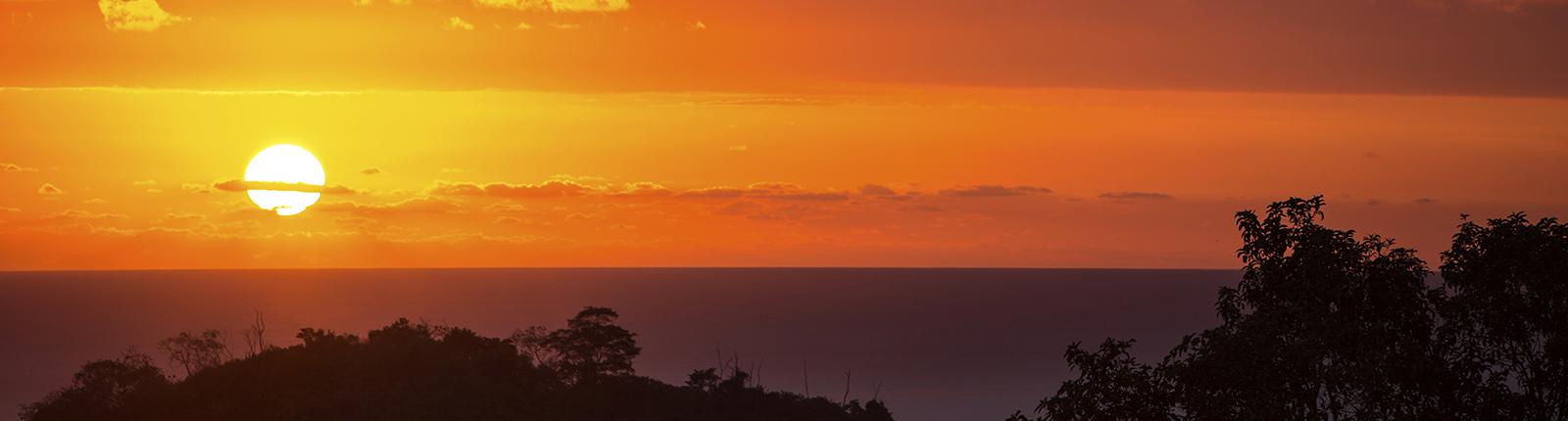 Beautiful orange sunset horizon in Puntarenas, Costa Rica