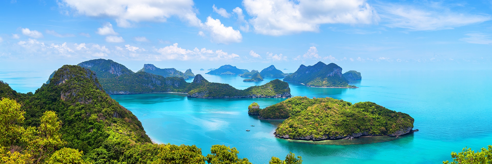 oceans weave around lush green islands located in koh samui