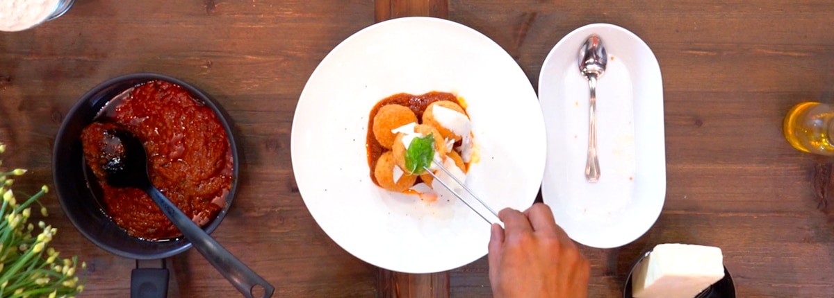 cucina del capitano's pasta arancini dish prepared on white plate