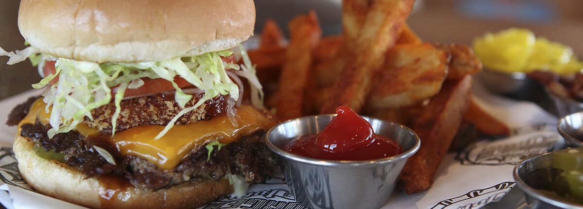 Guy Fieri Burger with a side of french fries