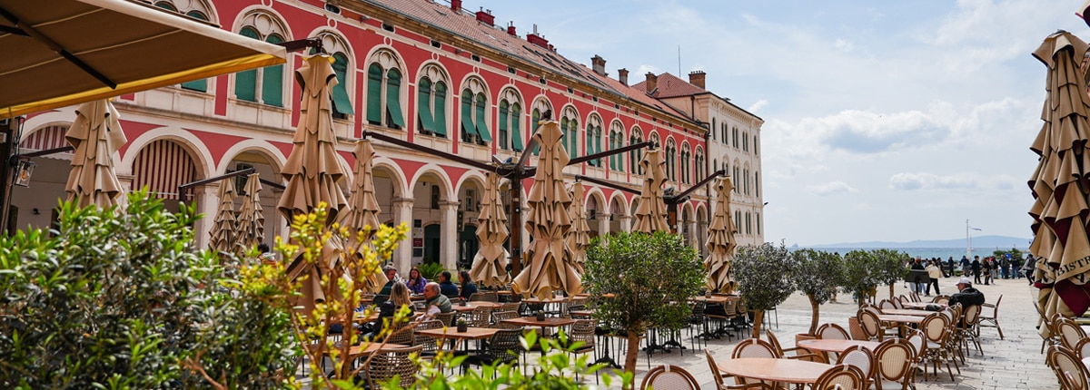 dining tables are located near a plaza in split croatia