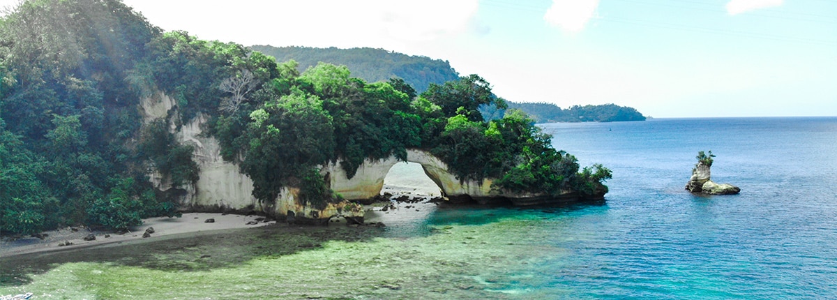 natural arch on serena beach near bitung