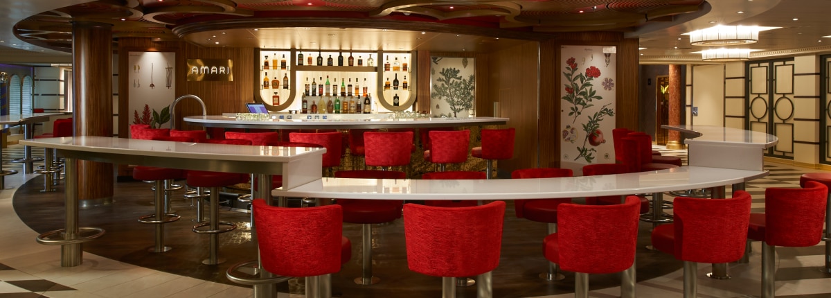 red chairs circle the amari bar