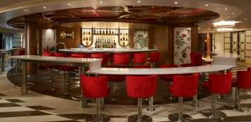 red chairs circle the amari bar