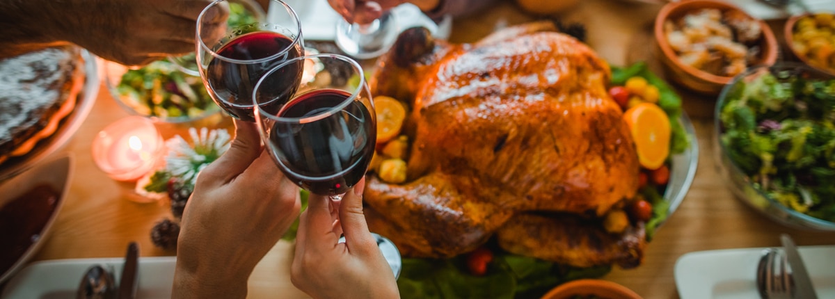 a table filled with a thanksgiving turkey and side dishes