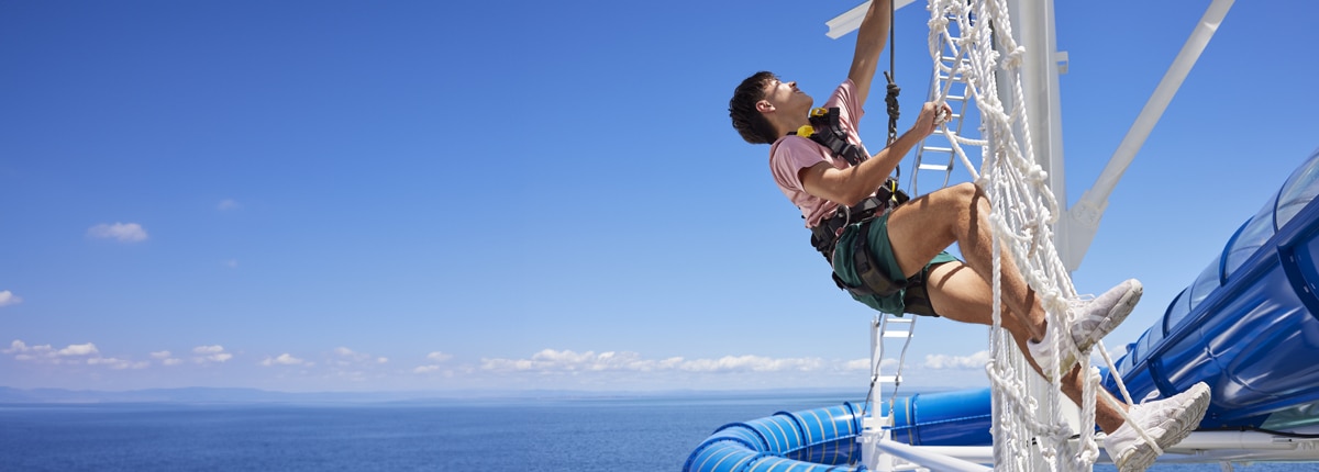 a man climbs ropes