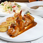 sauted shrimp are lined up on a dish