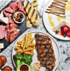 a mixture of meats, fries and broccoli are served on a dish